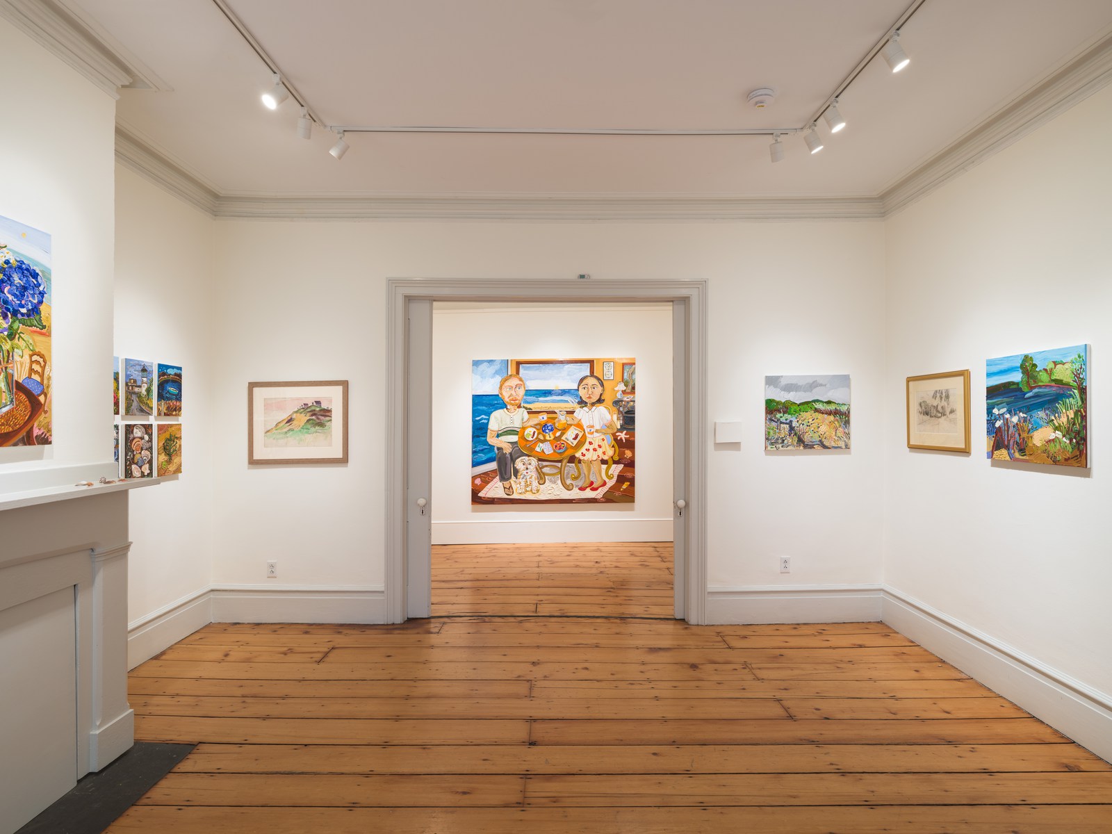 Cape Cod paintings by Susan Chen in two connected rooms at Edward Hopper House, seen through a doorway