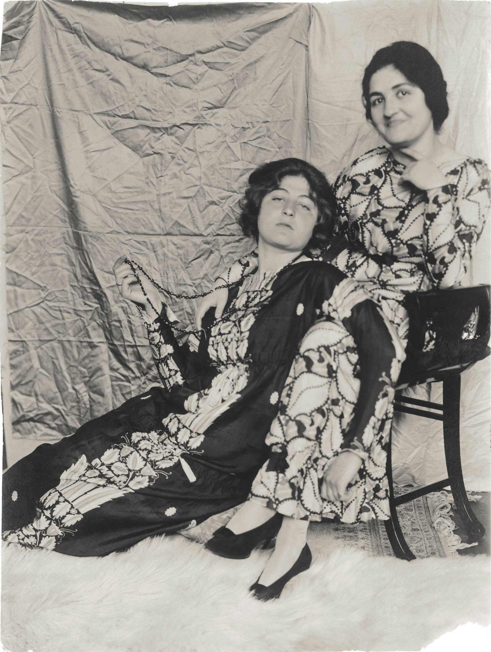 Charlotte Beer and Friederike Maria Beer posing in long patterned Wiener Werkstätte dresses, 1914