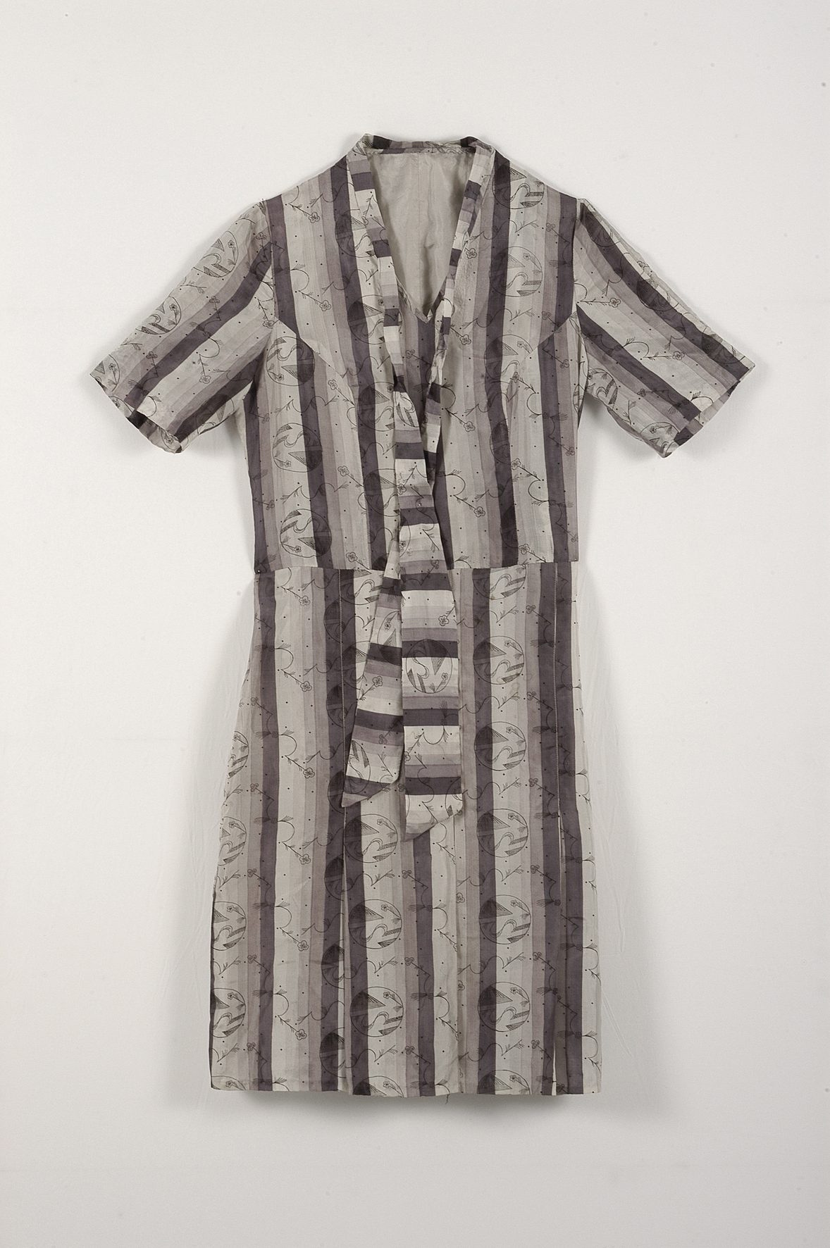 Maria Likarz, dress in “Night Sky” fabric, a short-sleeved silk dress with a dark striped print